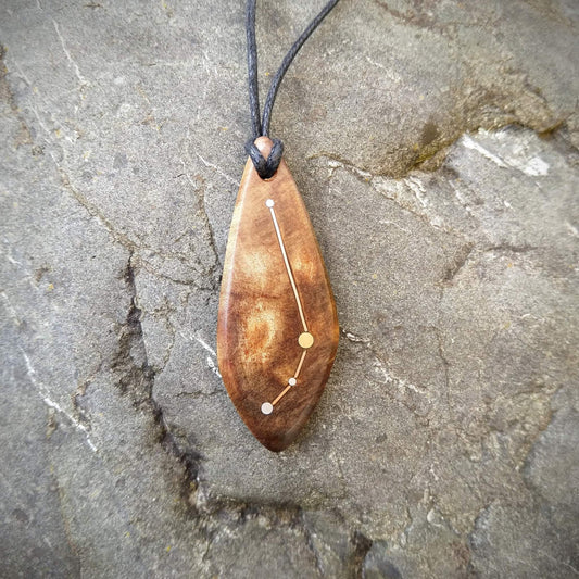 Aries Pendant on Swamp Kauri with Metal Inlay in the shape of the constellation.