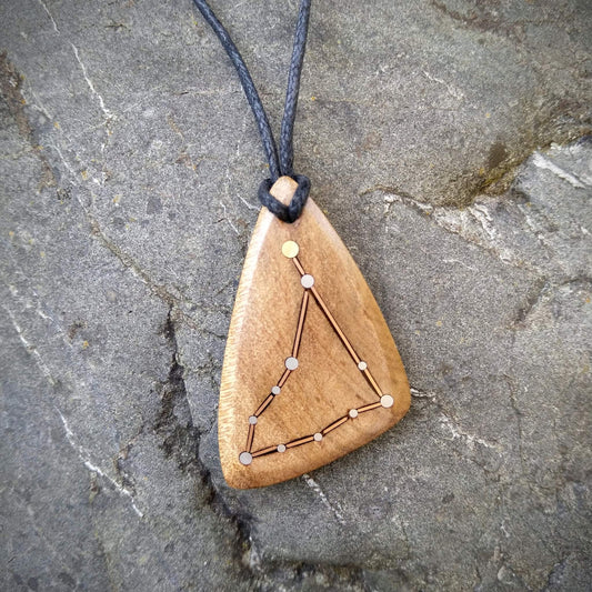 Capricorn Pendant on Swamp Kauri with Metal Inlay in the shape of the constellation.