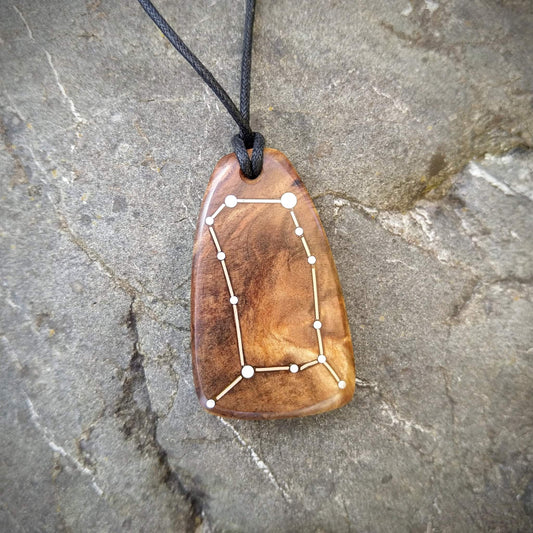 Gemini Pendant on Swamp Kauri with Metal Inlay in the shape of the constellation.