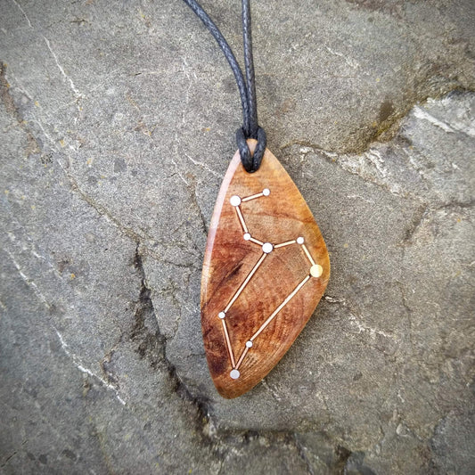 Leo Pendant on Swamp Kauri with Metal Inlay in the shape of the constellation.