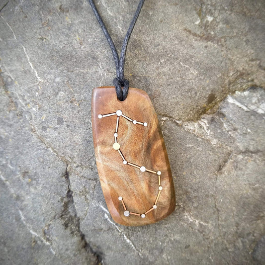 Scorpio Pendant on Swamp Kauri with Metal Inlay in the shape of the constellation.